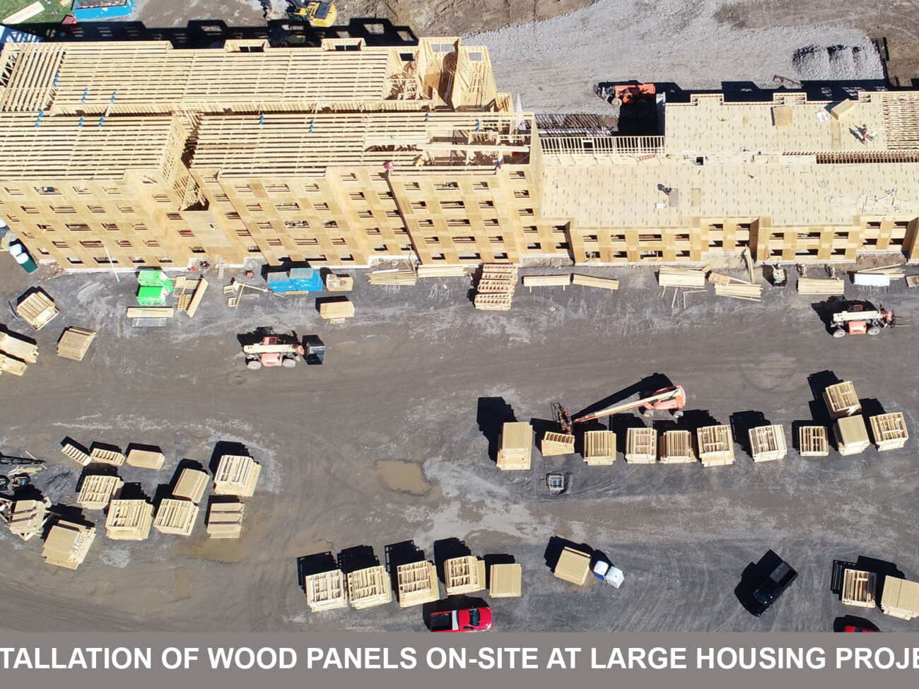 installation of wood panels on-site at large housing project