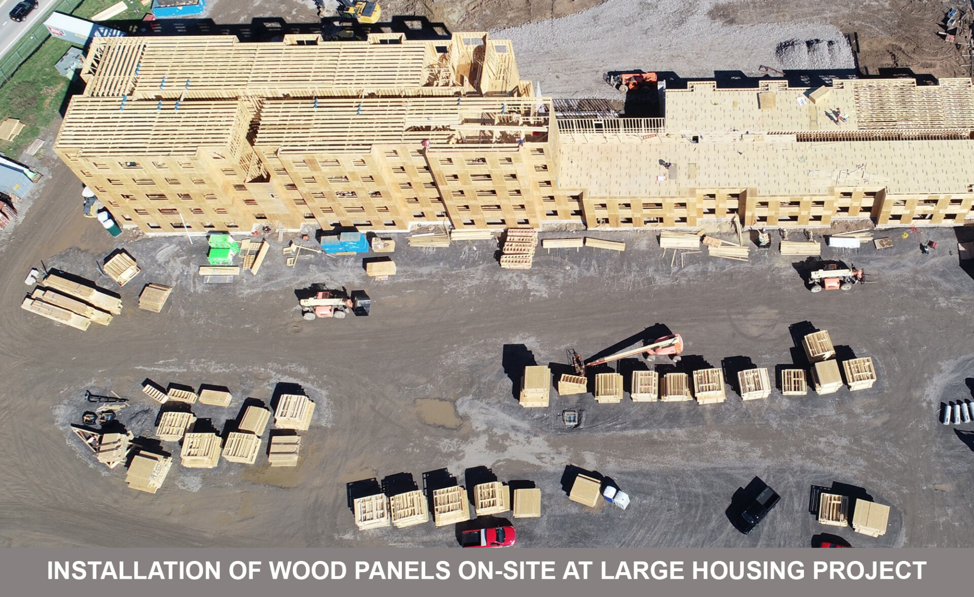 installation of wood panels on-site at large housing project