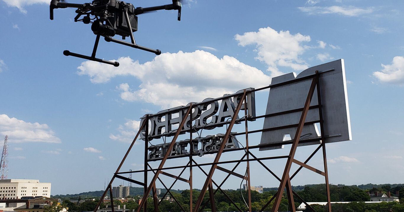 drone over Passero Associates sign in Rochester NY